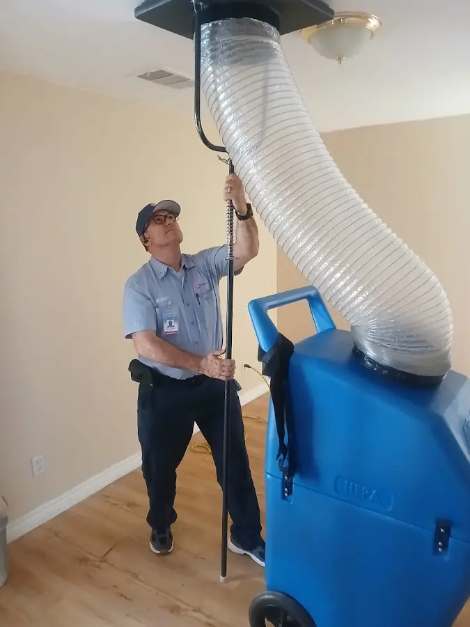 Furnace Tune-Up technician using HEPA equipment in Airway Heights